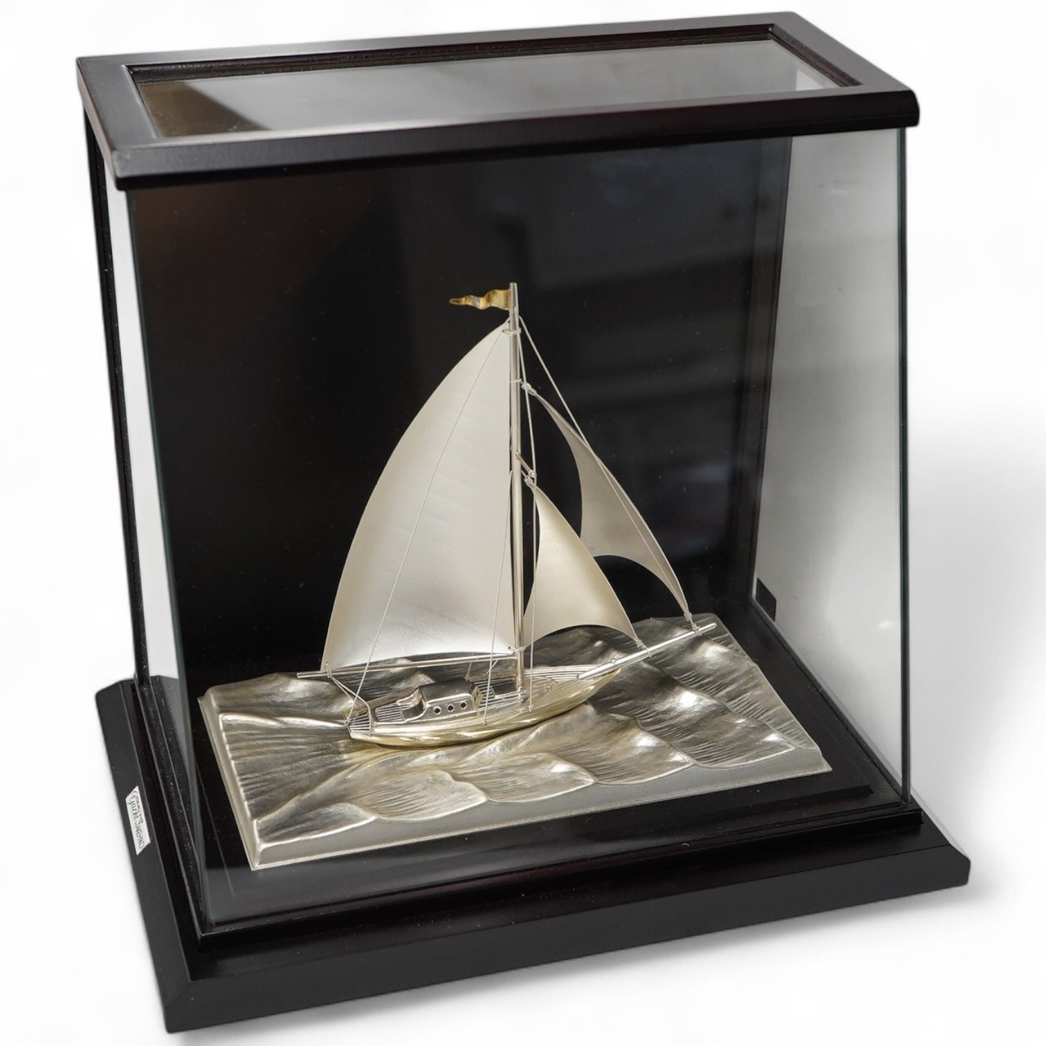 A modern sterling miniature model of 'Yacht No.6 Cutter' by Takehiko, in a presentation case, fixed on a wooden base, yacht dimensions approximately height 13.4cm, length 15cm, with box and pamphlet.
